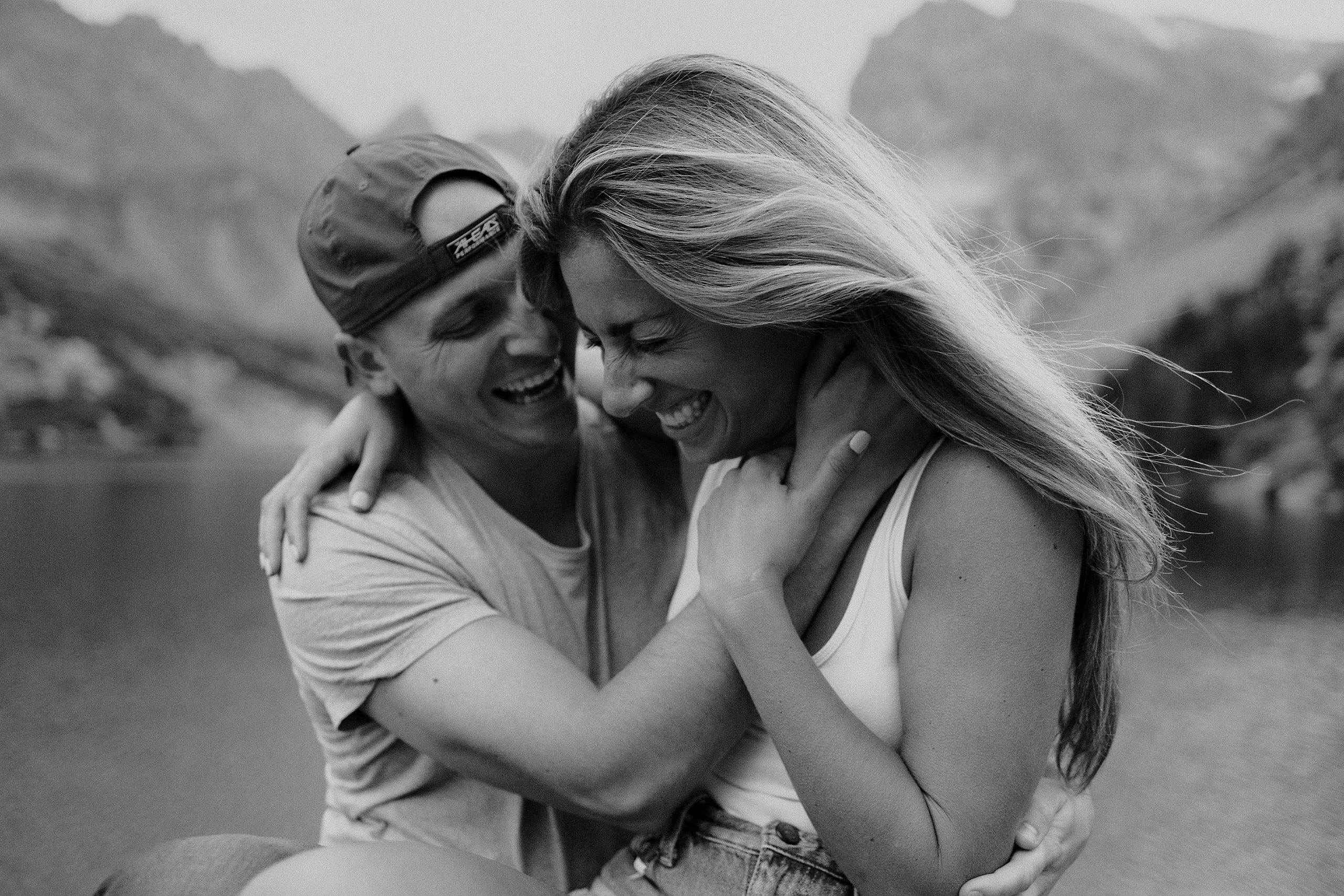 Couple laughing during their adventure session in Colorado