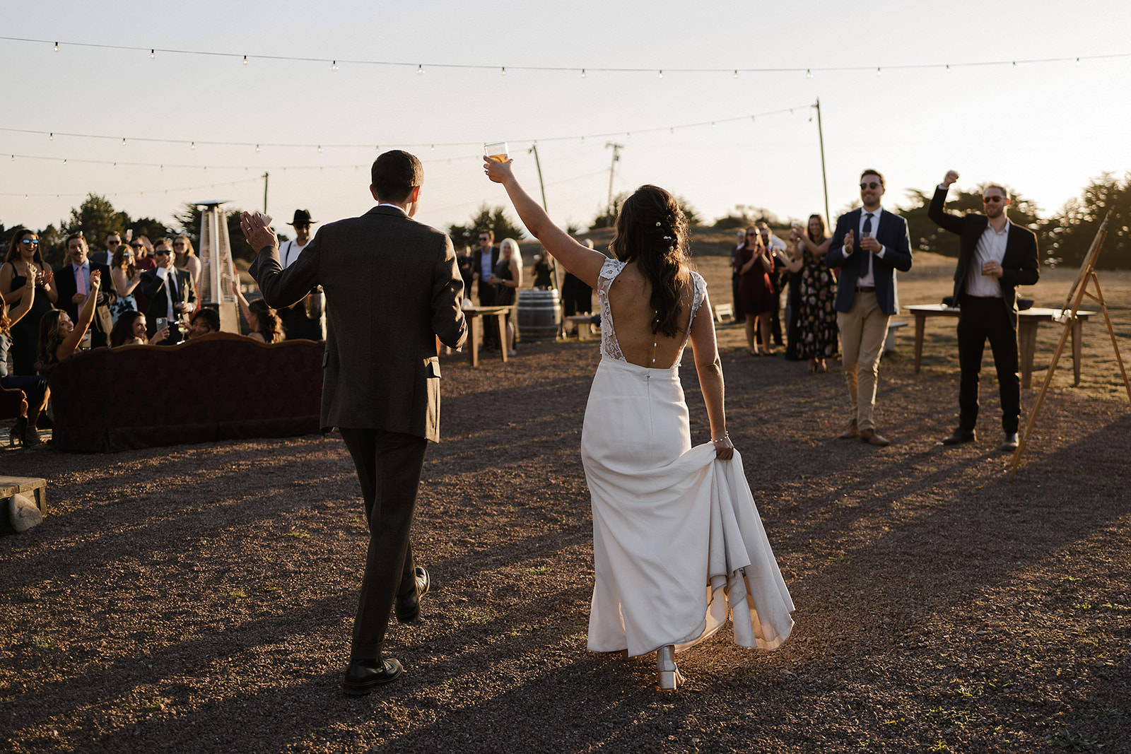 Newlyweds Toast at Rustic Cuffey Cove Wedding, Elk - Enchanting Sunset & String Lights .