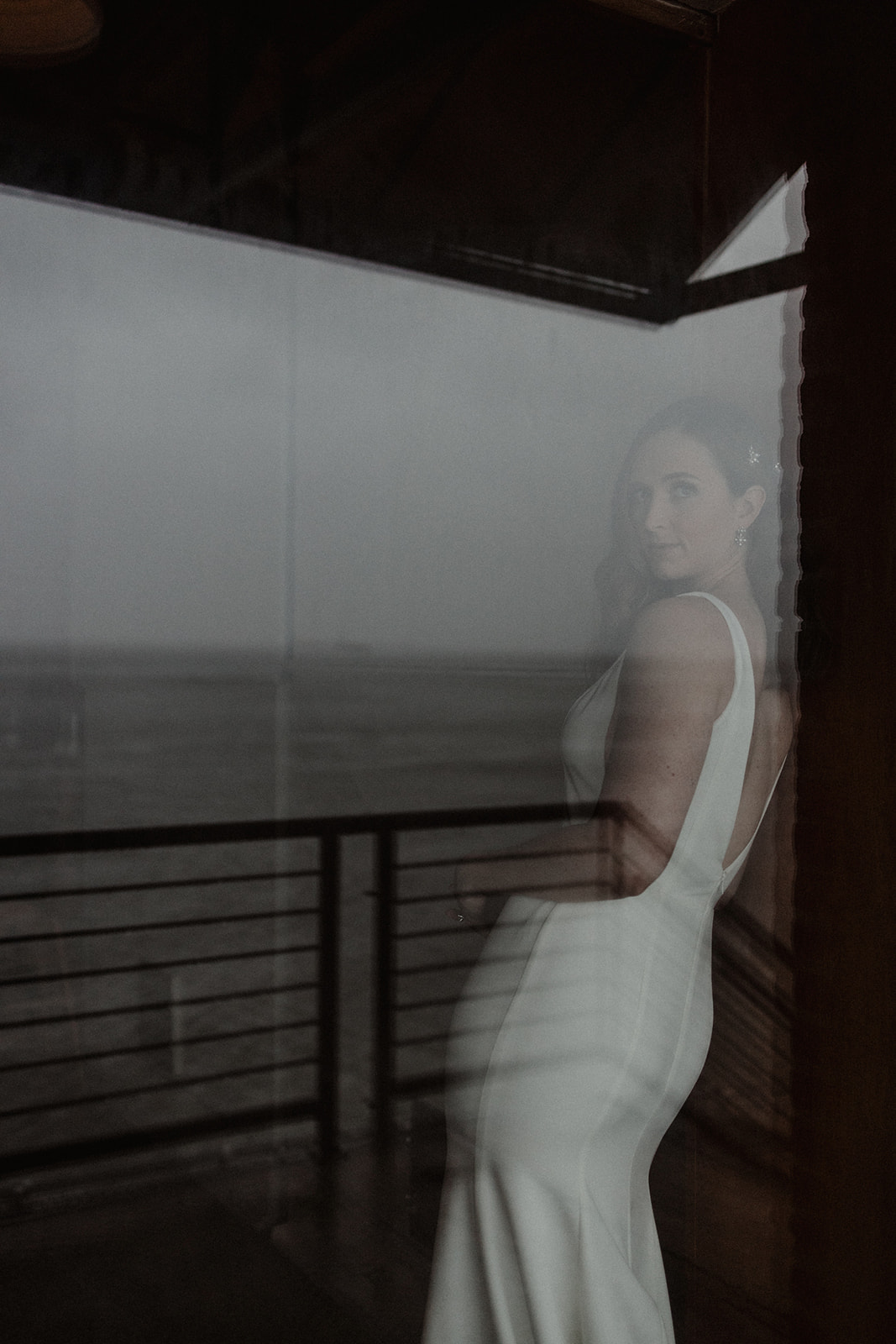High-End San Francisco Wedding Photography: Bride in Sleeveless White Dress Reflection.