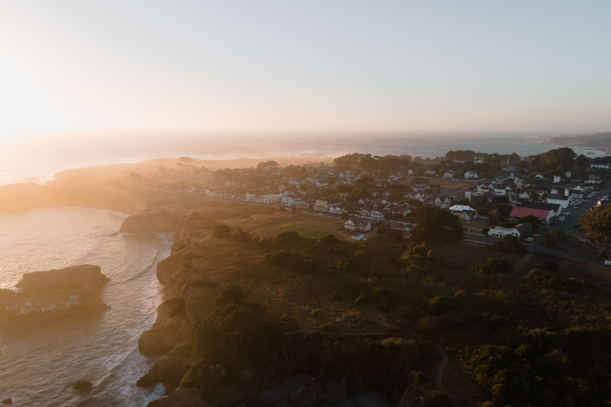 Capturing Mendocinos sunset: A serene coastal wedding with soft sunlight and ocean views.
