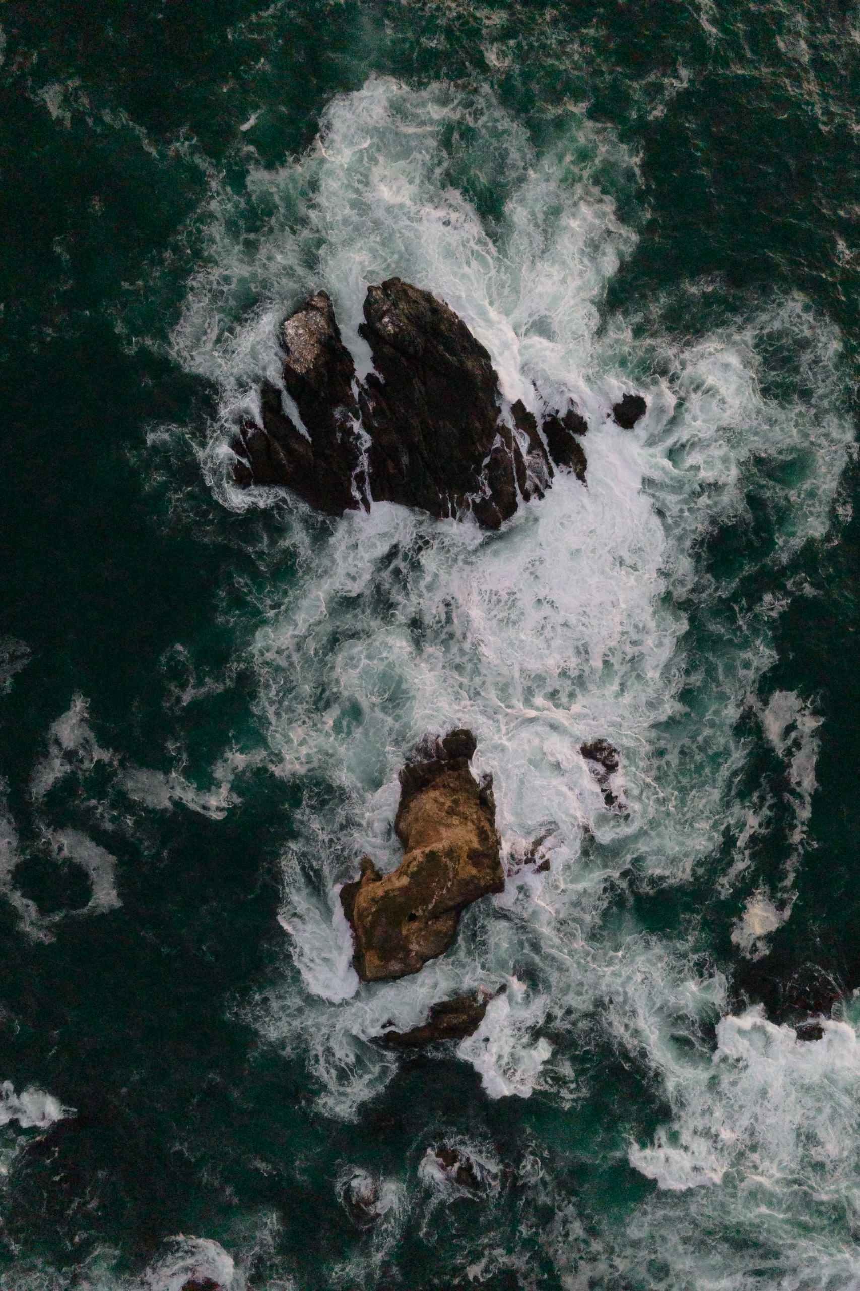 Mendocino Wedding: Aerial Ocean Waves & Rugged Coastal Rocks.