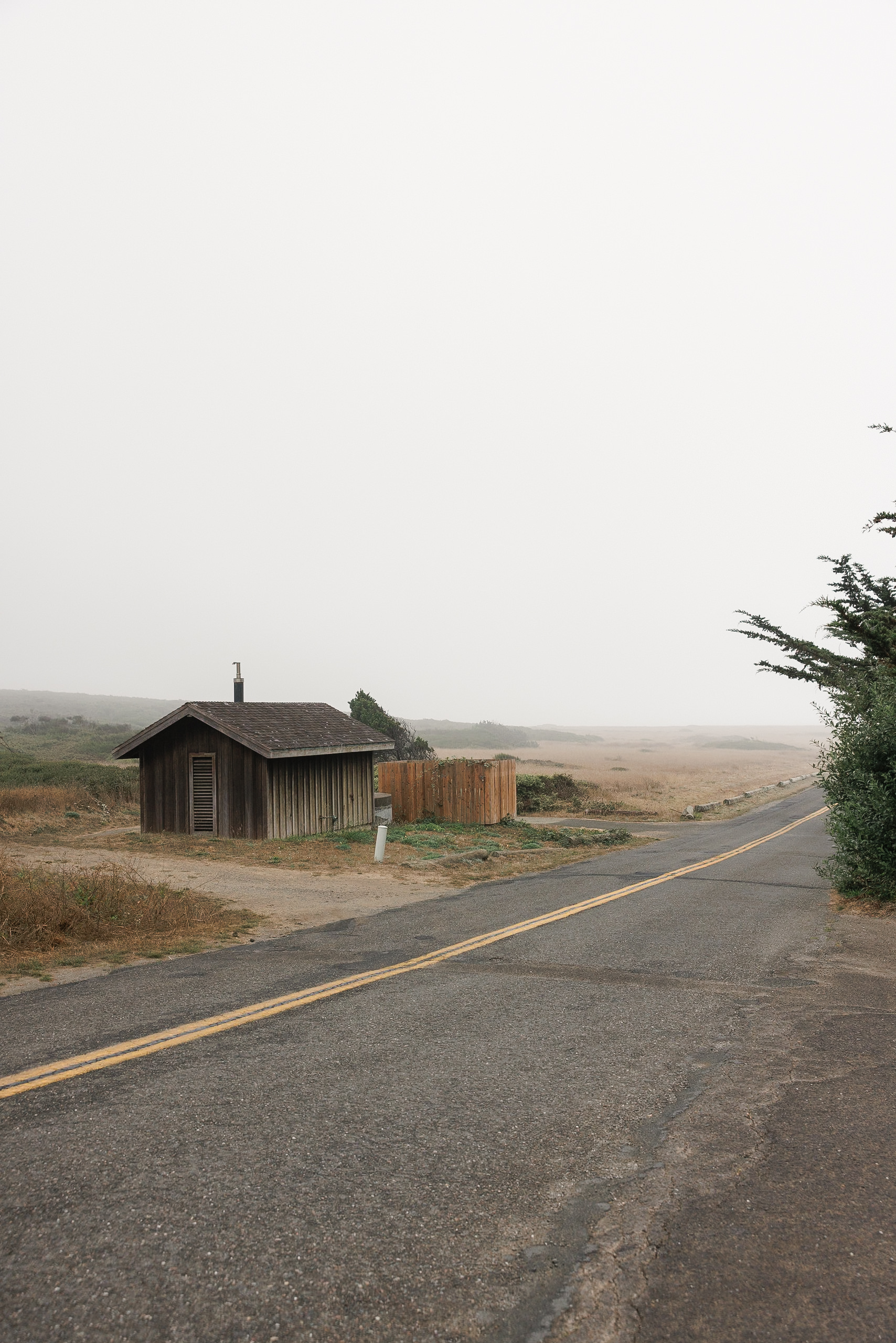 Mendocino countryside wedding photography: rustic cabin, tranquil skies, serene landscape.