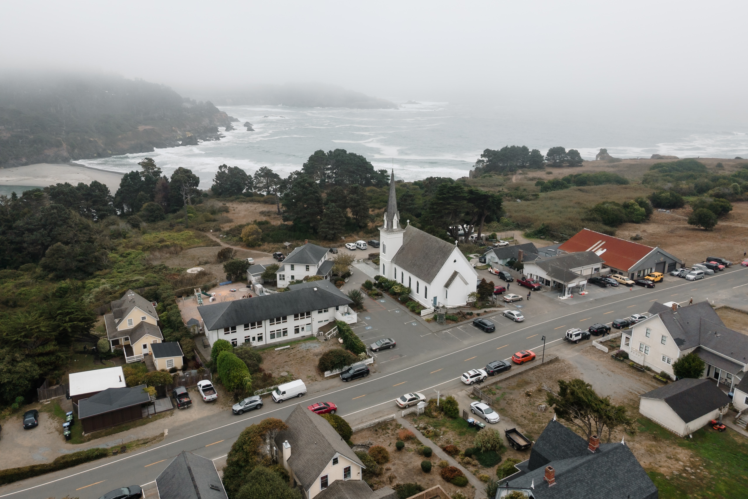 Aerial View of Historic Mendocino Church Amidst Coastal Fog – Fine Art Wedding Photography.
