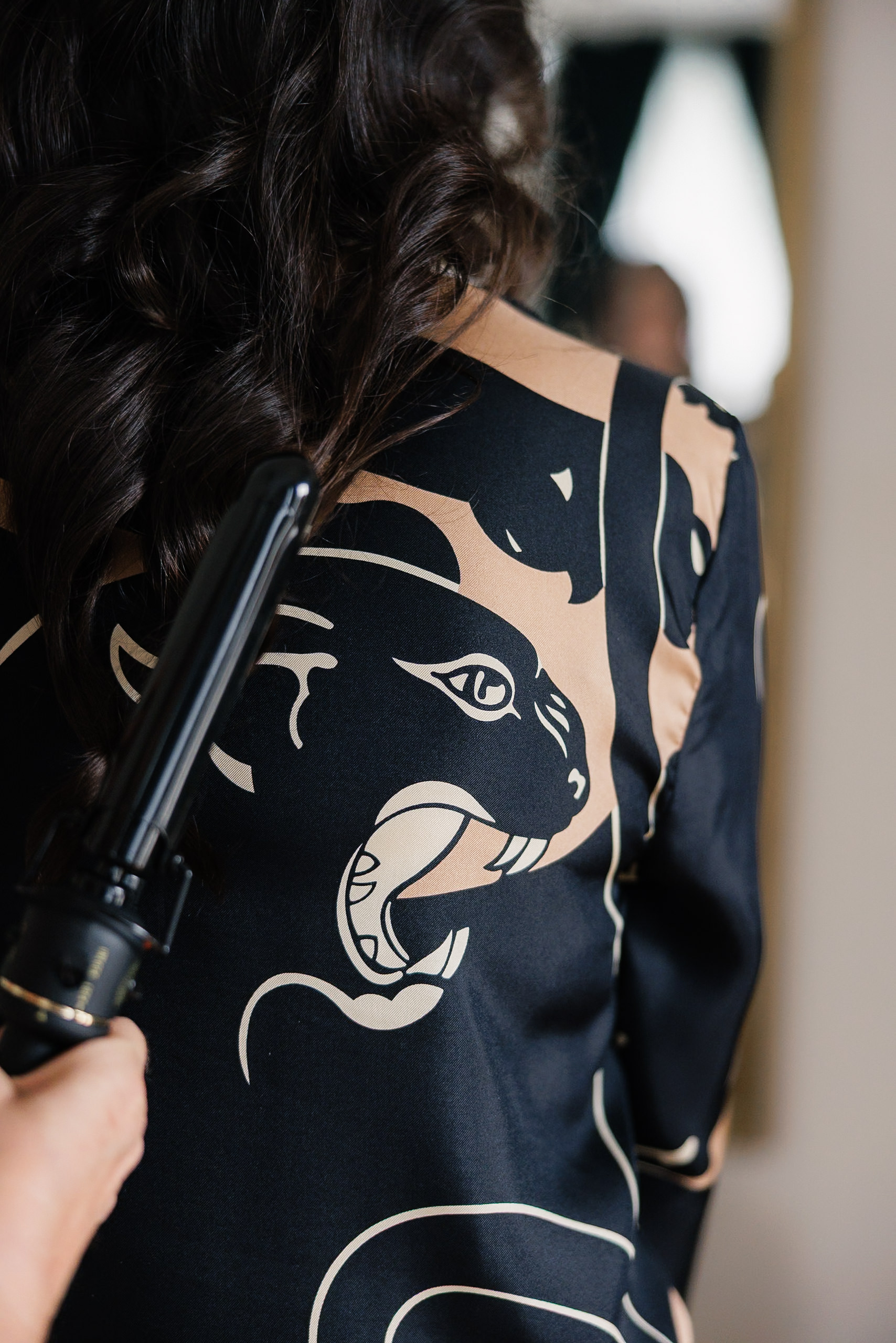 Capture Bridal Beauty: Mendocino-Inspired Waves Styled in Luxurious Panther Graphic Attire.