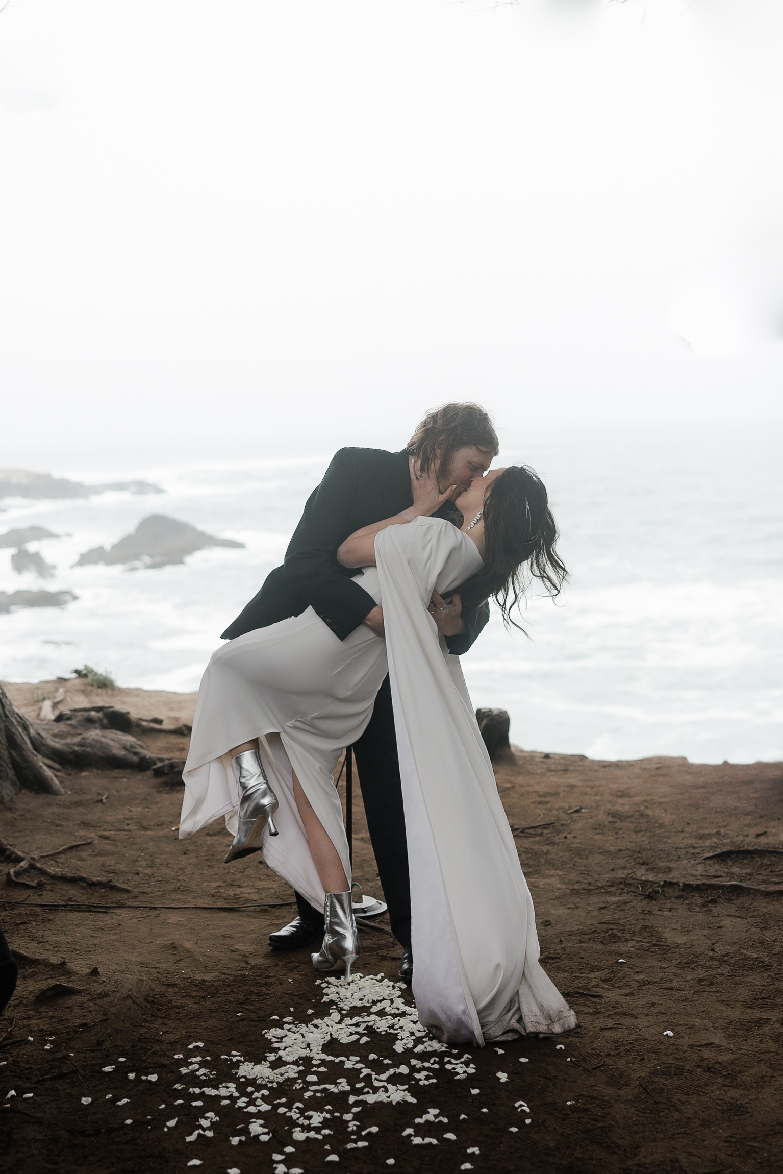 Capturing a romantic ocean kiss: Mendocino wedding photographers dream.