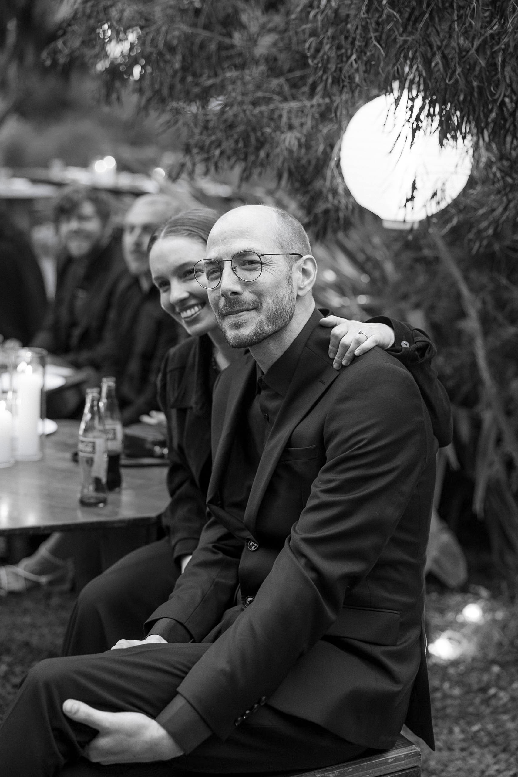 Elegant black-and-white photo of a joyful couple in Mendocinos romantic candlelit setting.