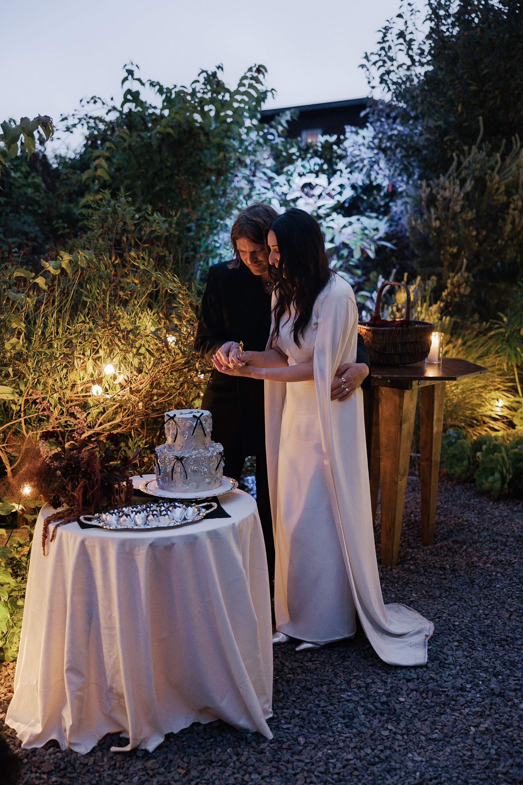 Elegant Wedding Cake Cutting in Scenic Mendocino Garden: Lush, Romantic, Intimate Celebration.