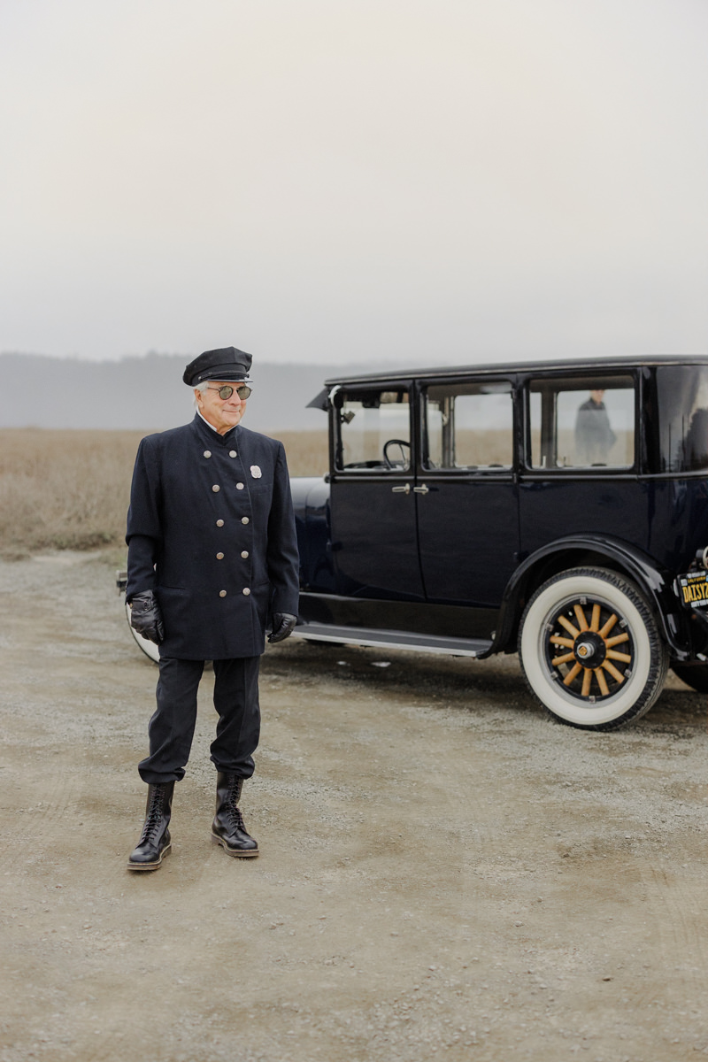 Vintage Chauffeur and Classic Car: Timeless Elegance Captured Outdoors.